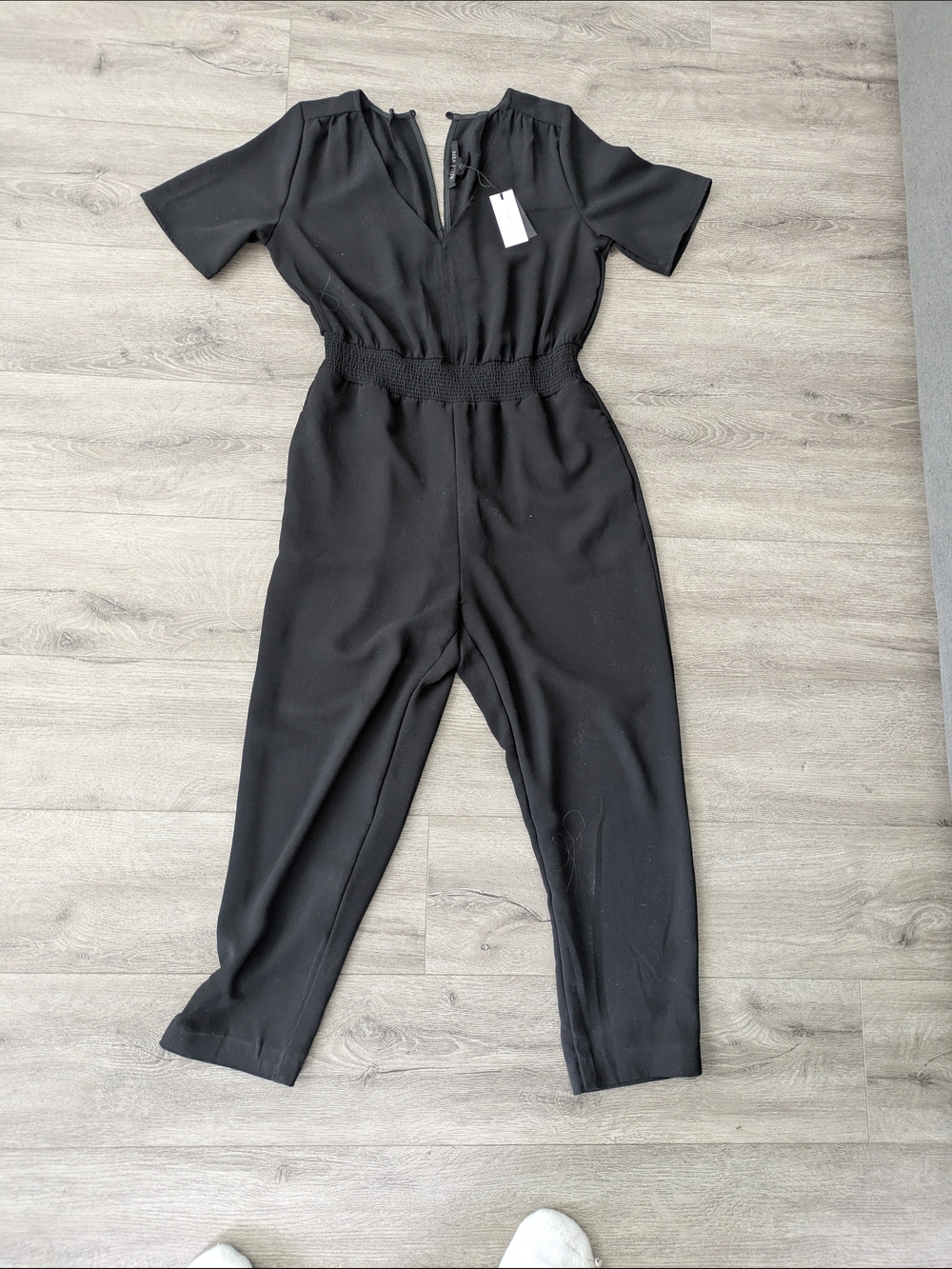 Elegant Black Smocked-Waist Jumpsuit with V-Neck
